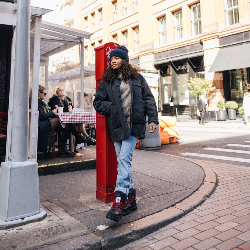 a person standing on a sidewalk